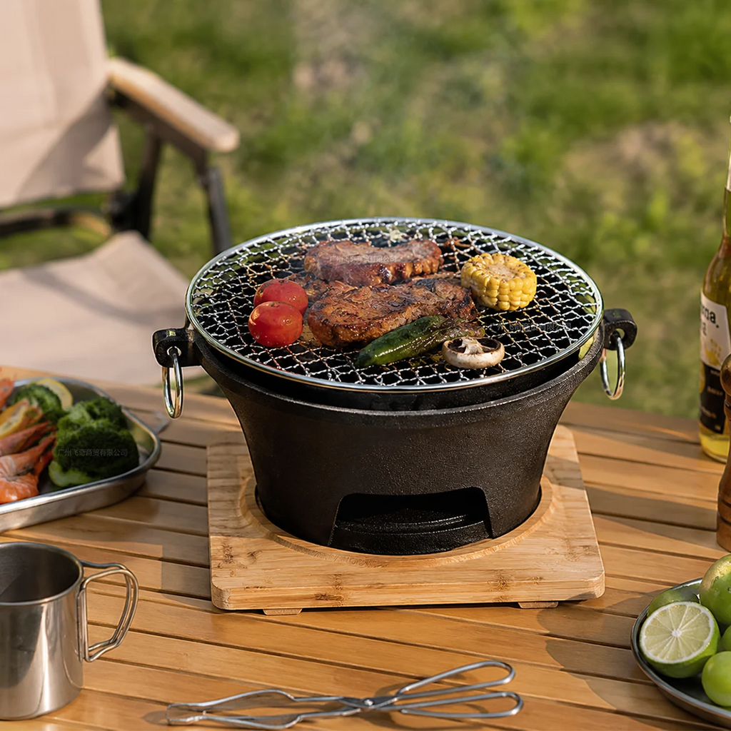 Zoe KL1 Portable Charcoal Grill Mini Tabletop BBQ Cast Iron Body Stainless Steel Removable Grill Net Heat-Resistant Wooden Base Silver Carry Rings Outdoor Picnic and Backyard Cooking