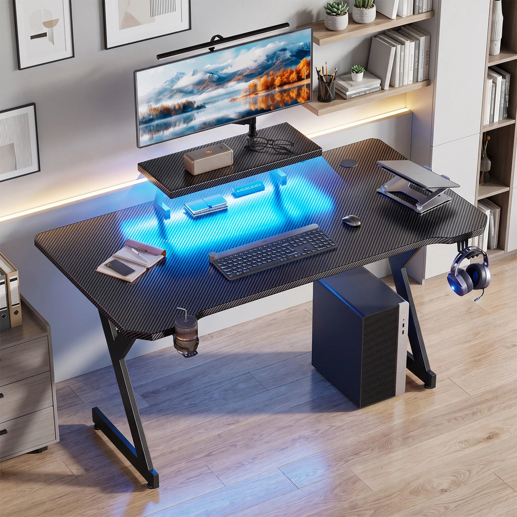 Ergonomic Gaming Desk with Elevated Monitor Riser Stand & Built-in LED Light Strip, Large Curved Carbon Fiber Surface Computer Desk