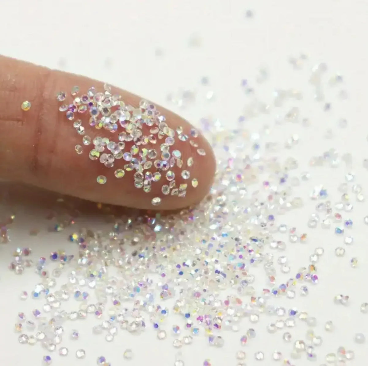 1Bag Aprox.1400Pcs Mini Nail Rhinestones Micro 1.2mm Nail Sand Pixie Crystals Iridescent AB Bling Tiny Sugar Beads Nail Charms
